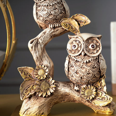 Rustic Owls Perched on a Branch