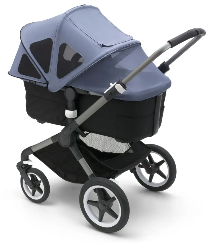 bugaboo fox 3 stroller set up as a bassinet with a breezy canopy in blue