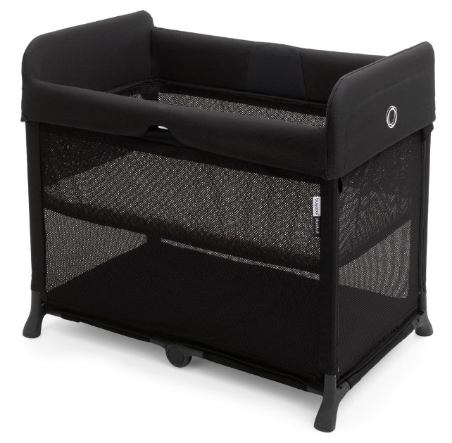a bugaboo stardust crib in black with the bassinet installed on a studio white background