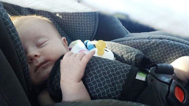 baby asleep in infant car seat