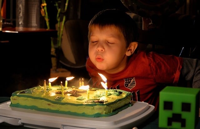 birthday gifts boy blowing out candles