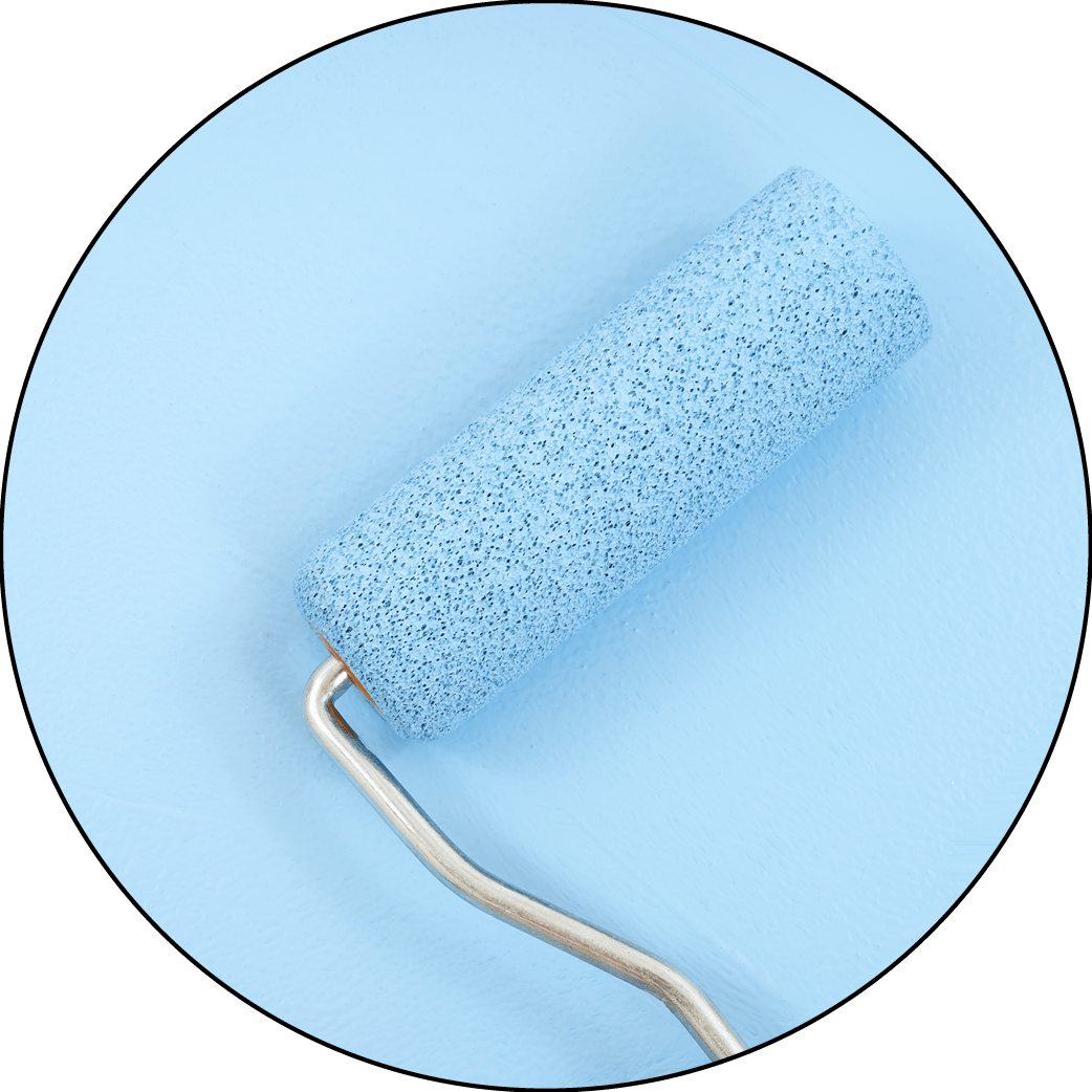 A paint roller frame painting a blue wall