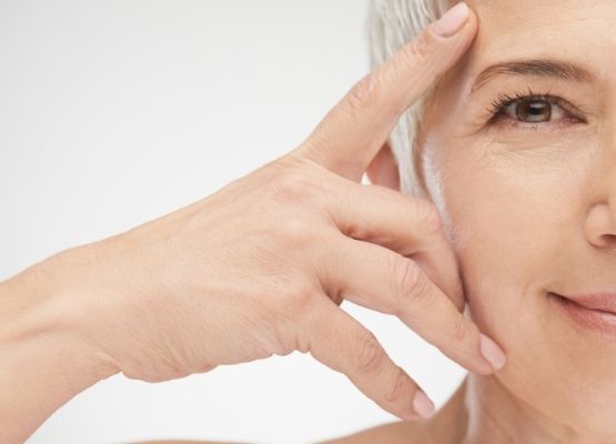 Image of a mature lady who uses a camel milk skincare serume 