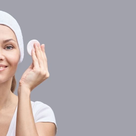 Image of a young woman using a toner 