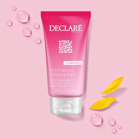 Declare Cleansing Balm on a pink background with water drops