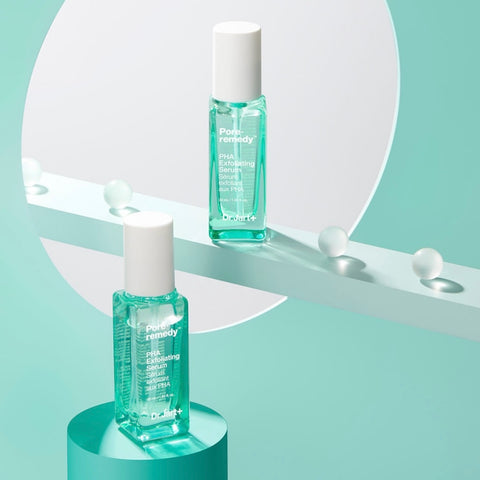 Two bottles of Dr Jart+ Pore Remedy PHA Serum against spotted white and mint coloured wall