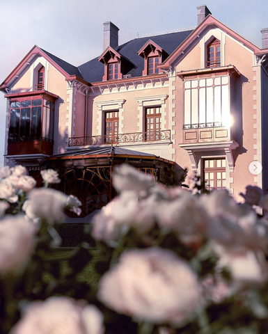 Dior's Normandy house with roses in the foreground