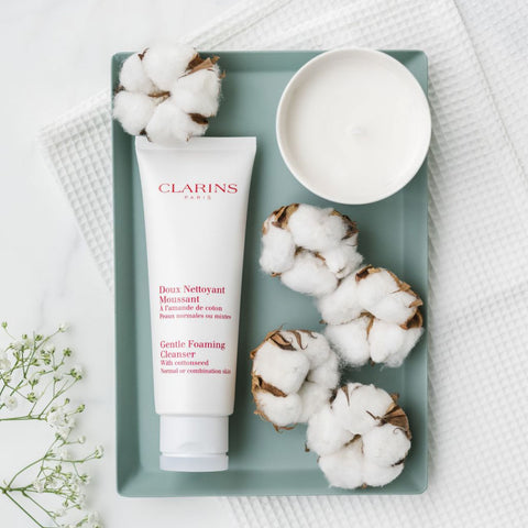 Clarins Gentle Foaming Cleanser flatlay with pieces of cotton