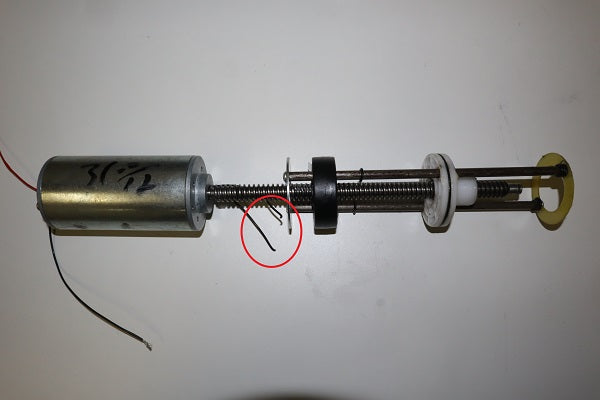 Cut the loop of wire that comes off the top of the motor at the center.