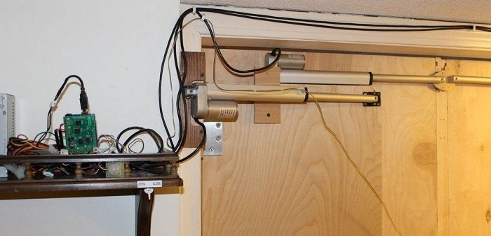  Automated secret bookcase door with linear actuator