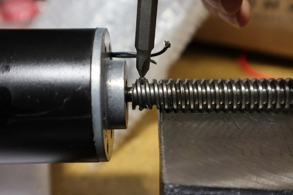 Position the actuator onto your vice or similar block and use an appropriate punch to remove the pin