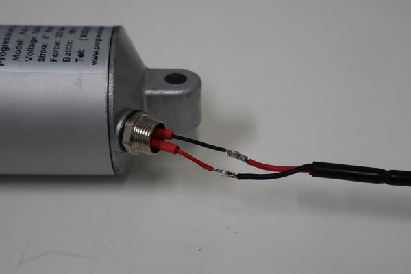 Solder the section of wire exterior to the actuator to the wire ends of the motor