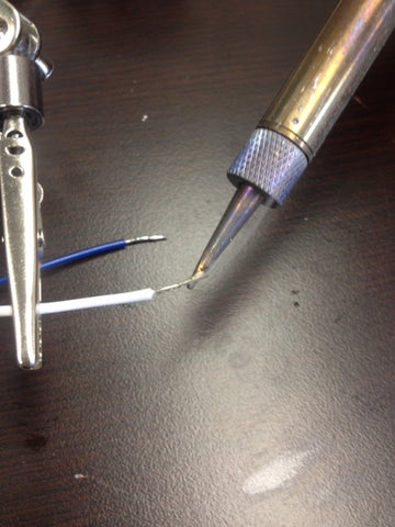 Photo of solder of tin ends to prevent fraying