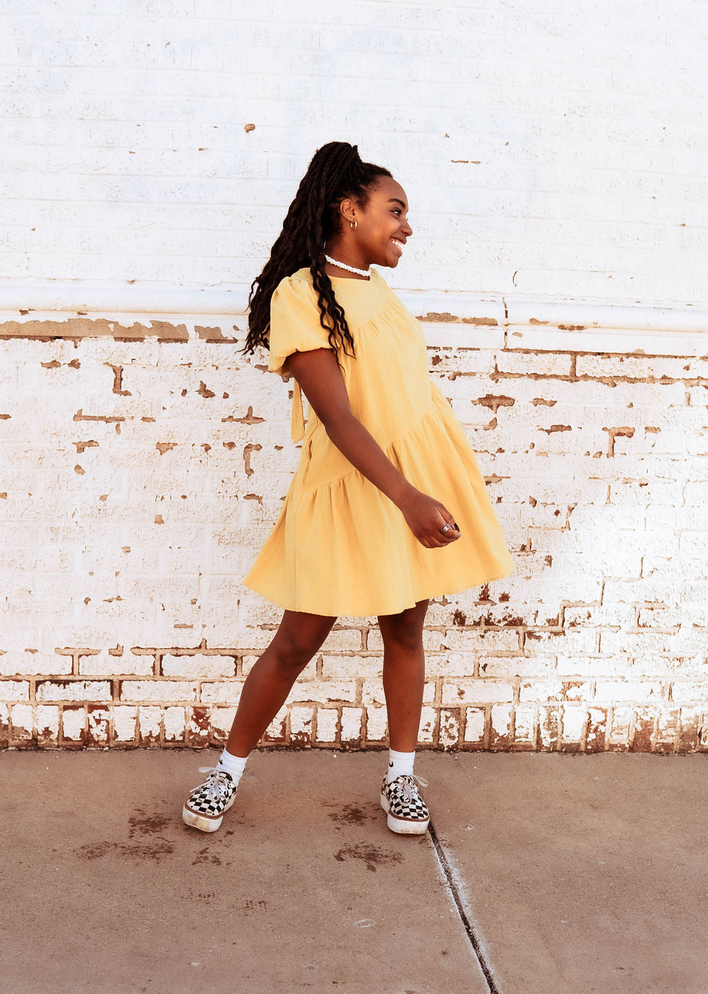 This gorgeous yellow mini dress is such a fun addition for spring! The tiered look makes for a fun A-line and is so much fun with boots! Paired with a cute leather jacket and chunky boots, it is a winter must-have! Pair it with some cute converse and its a spring/summer must have!