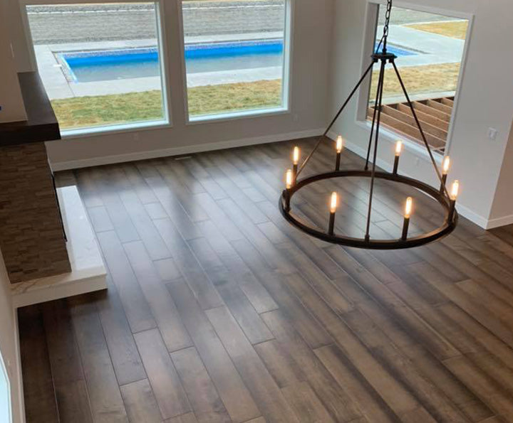 Living room floor with Shaw inspiration hardwood in maple, available at Standard Paint & Flooring