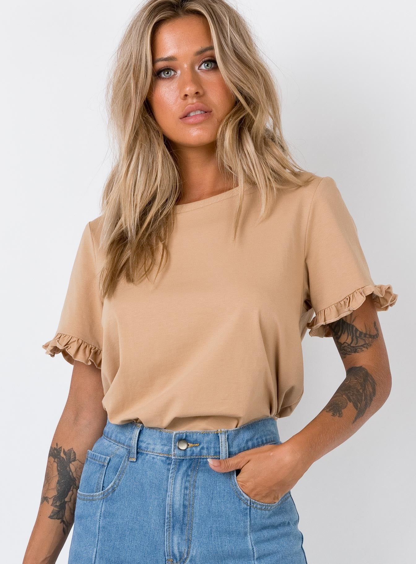 beige ruffle top