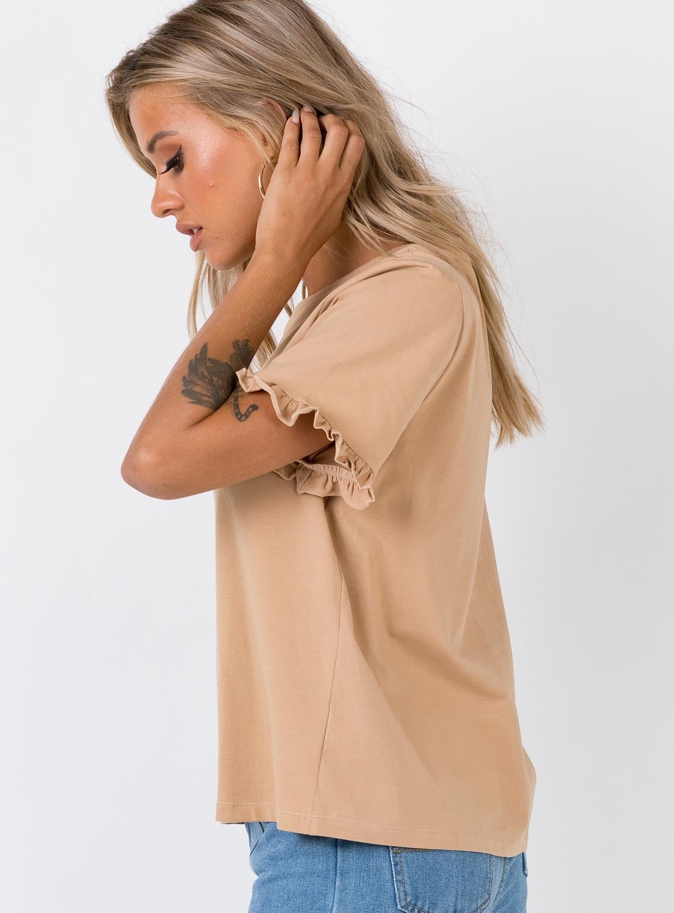 beige ruffle top