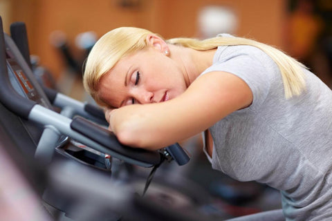 Exercise boredom - woman sleeping at the gym