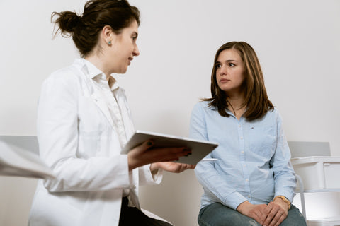 Physiotherapist talking with patient