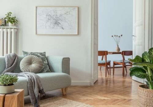 Interior home living room painted in a light & airy pastel green tone. A portrait of  paint colours from the 2021 Trends collection used in the interior of a home.