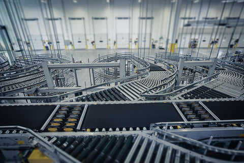 A series of conveyors and automated sorting systems installed at an e-commerce warehouse