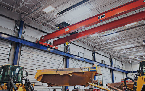 A 15-ton overhead cranes supports a large piece of machinery