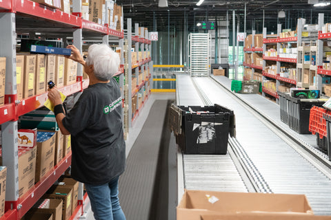 Warehouse employee at Cottonwood Distribution picks product to fulfill orders from clients