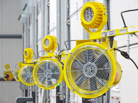 Air circulation fans and safety lights installed next to warehouse dock doors