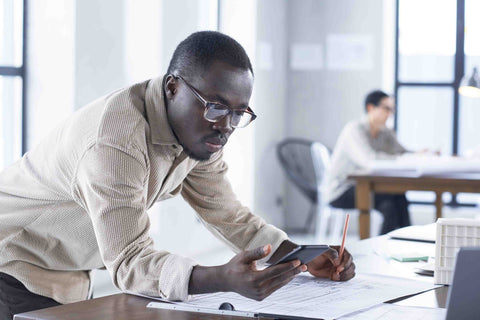 Business owner checking over warehouse plans