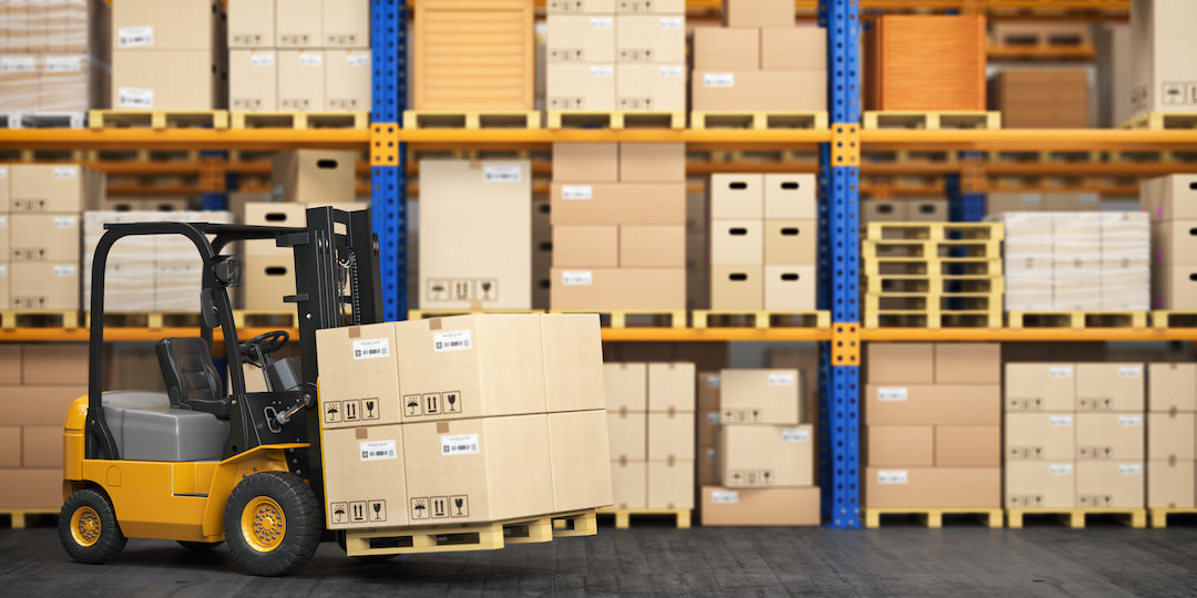 forklift in front of loaded pallet racking shelves