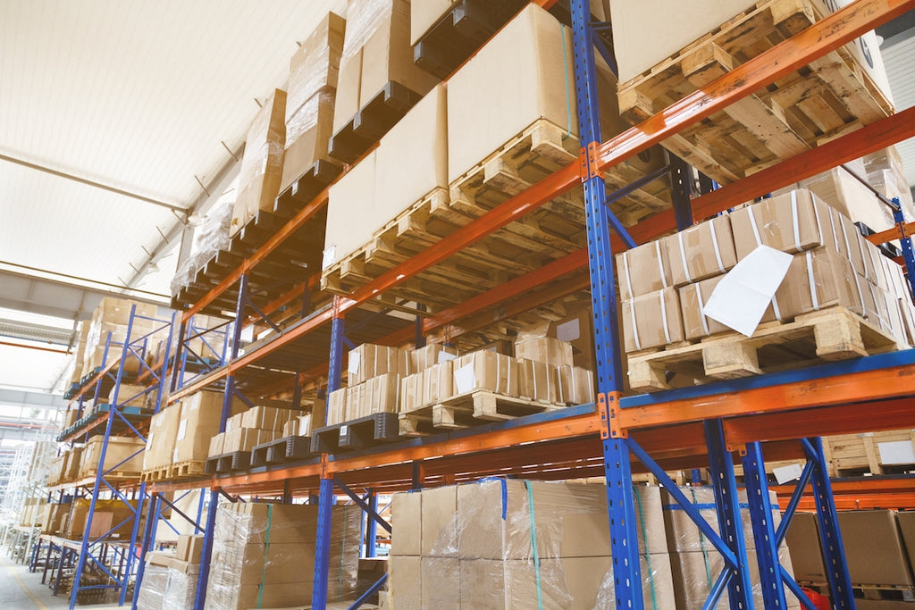 Items are stored on industrial pallet rack shelving in a warehouse