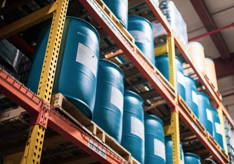 Barrels of chemicals are stored on pallet rack shelving at Thatcher Chemical