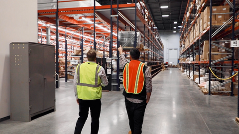 Men walking in warehouse