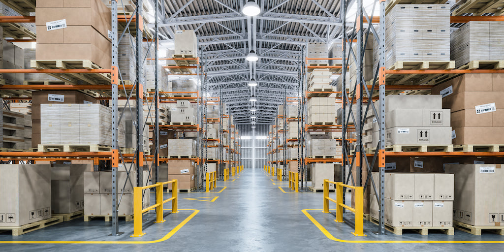Rows of industrial shelving store goods in a warehouse