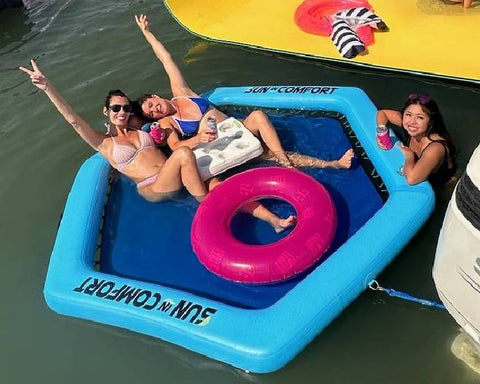 sun in comfort water floats 2 females floating around at the Florida sandbar 