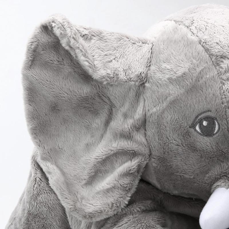 baby with elephant pillow