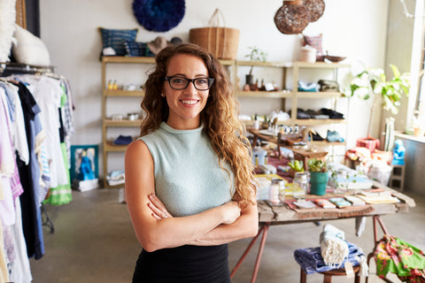 Young female business owner in a clothes shop, portrait