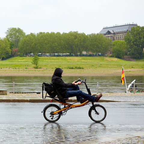 recumbent bike bicycle sit down man in puddle
