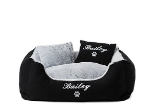Black fluffy dog bed with custom embroidery of pet name in white