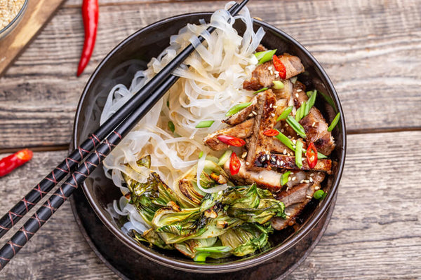 Seared pork with bok choy and rice noodles