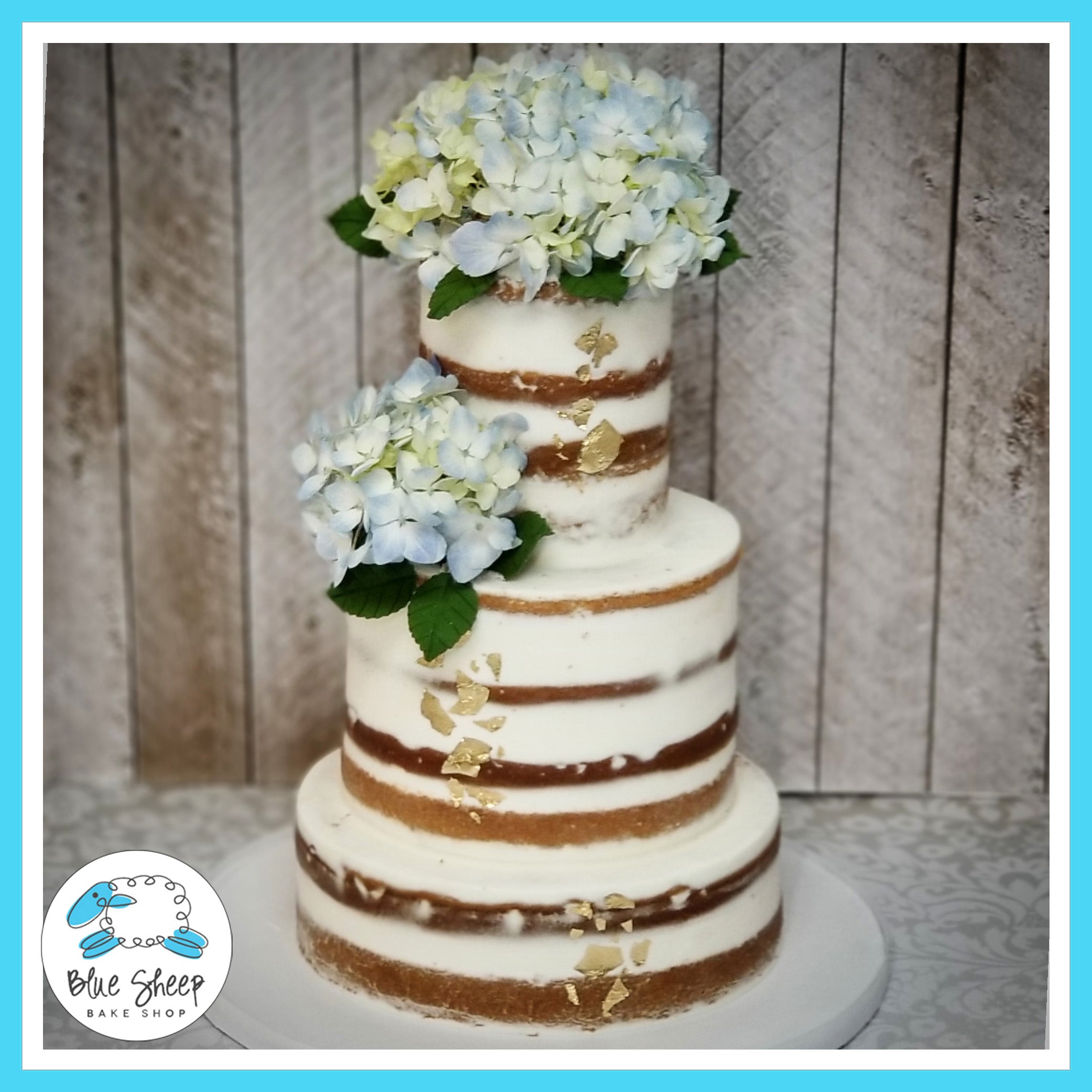 Naked Wedding Cake with Blue Hydrangea – Blue Sheep Bake Shop