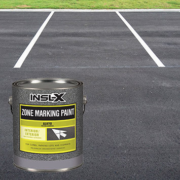 An empty parking lot with white painted lines marking parking spots, with an overlay image of a gallon of Insl-X Alkyd Zone Marking Paint.