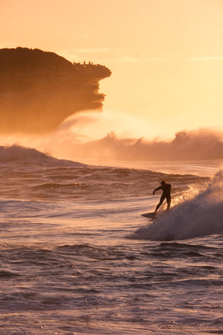 Surfer at dawn in Bronte
