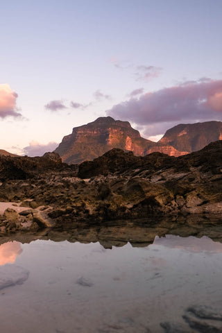 Sunset lights up the face of Mt. Gower in Lord Howe Island