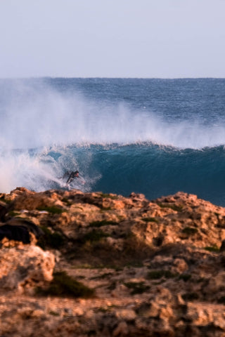 Sunrise barrel surfing at Red Bluff