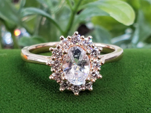 A rose gold starburst diamond ring