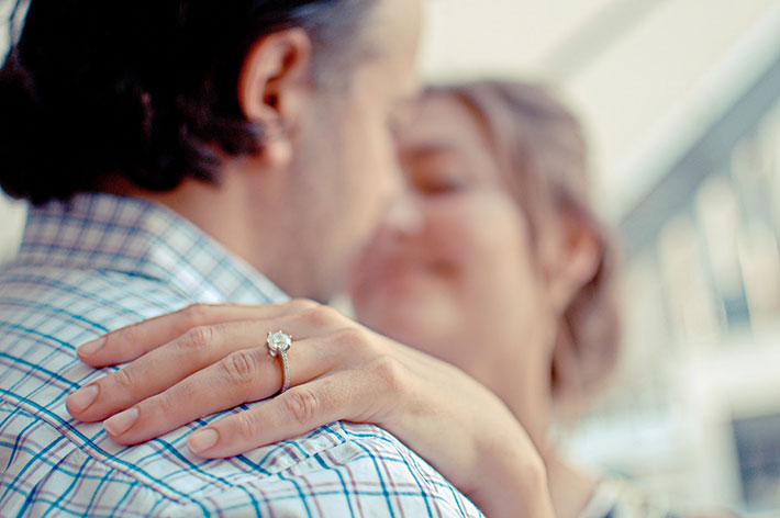 Woman with her hand on a man’s shoulder