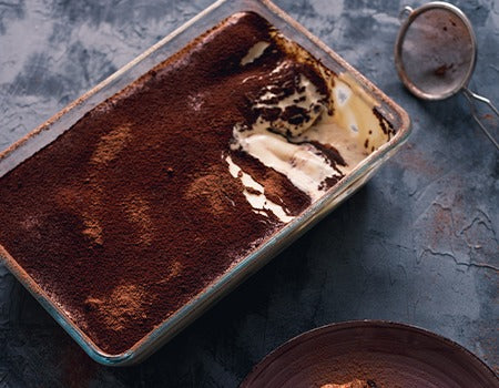 Eggless Tiramisu with sprinkled cocoa powder