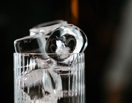 Martini glass with ice cubes