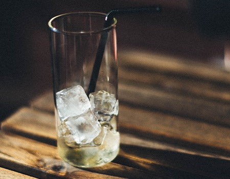 A glass filled with ice cubes